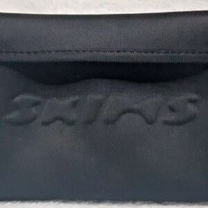 SKIMS Black Pouch